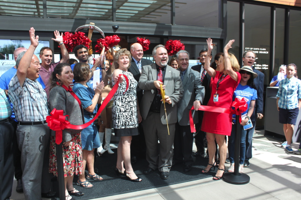 Mayor Matthews celebrates after cutting the ribbon at the grand opening of the Northside Library.